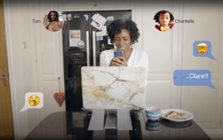 Preview still from A2Dominion customer service training drama showing a woman at her laptop receiving character messages on screen
