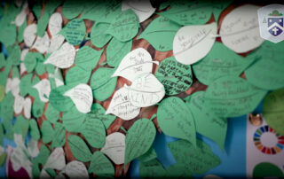 Bishop Challoner School kindness wall with handwritten leaves carrying messages from pupils including “Be Kind”